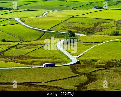 View looking down on the winding A537 road which runs between Buxton and Macclesfield on the Derbyshire and Cheshire border Peak District England UK Stock Photo