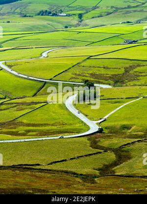 View looking down on the winding A537 road which runs between Buxton and Macclesfield on the Derbyshire and Cheshire border Peak District England UK Stock Photo