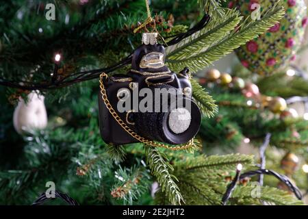 A Christmas decoration in the form of a 35mm SLR camera hanging on a Xmas tree Stock Photo