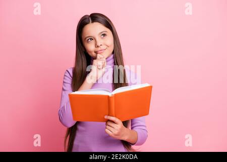 Portrait of her she nice attractive pretty cute creative curious brainy smart clever long-haired girl reading academic paper book pondering isolated Stock Photo