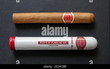 Athens Greece, December 30, 2020. Cigar Romeo Y Julieta package. Cuban premium quality and metal tube container isolated on black background, closeup Stock Photo