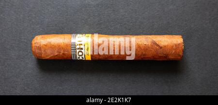 Athens Greece, December 30, 2020. Cohiba Cigar. Cuban premium quality brand robusto isolated on black background, closeup top view Stock Photo