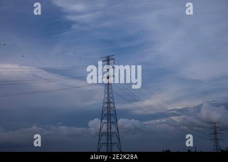 National grid electricity pylons on the Buriganga River at Narayanganj, Bangladesh Stock Photo