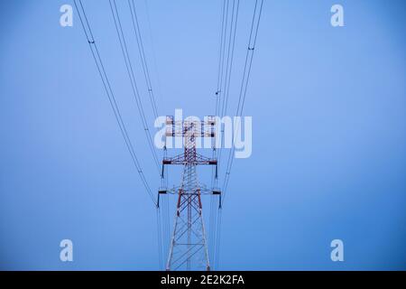 National grid electricity pylons on the Buriganga River at Narayanganj, Bangladesh Stock Photo