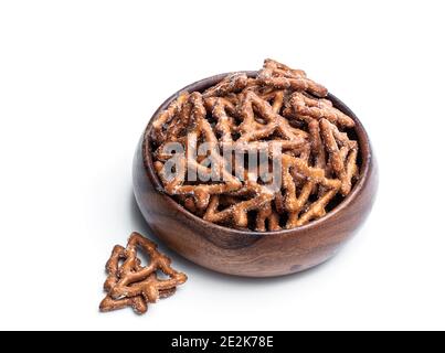 Christmas  tree shapes pretzel in wooden bowl isolated on white Stock Photo