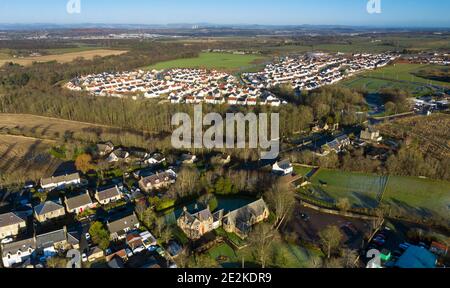 Aerial panoramic view of Calderwood housing development on the edge on East Calder village, West Lothian, Scotland Stock Photo