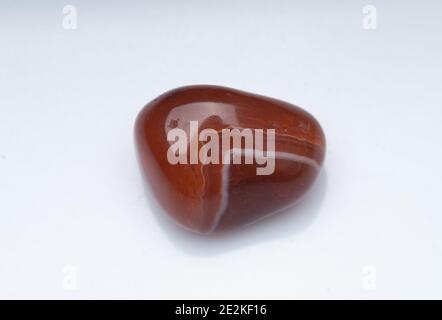 Natural stone carnelian on a white background Stock Photo