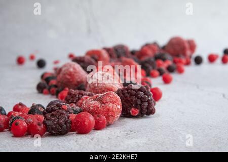 red berries scattered on a white background Stock Photo