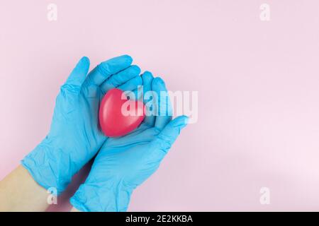 Cropped view of doctor holding red heart in hands, health insurance, donation, charity , saving life, thank you Stock Photo