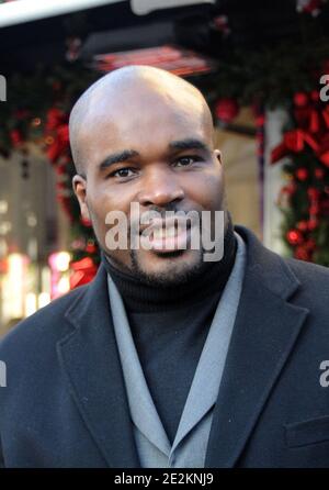 New heavyweight champion, French boxer Jean-Marc Mormeck poses as he exits the restaurant L'Avenue in Paris, France on January 4, 2010. Photo by ABACAPRESS.COM Stock Photo