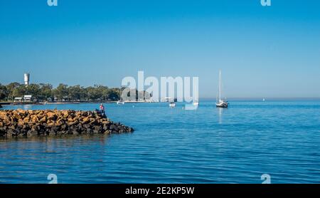 Pumicestone Passage at Bongaree foreshore on Bribie Island with view of Bongaree Jetty, Queensland, Australia Stock Photo