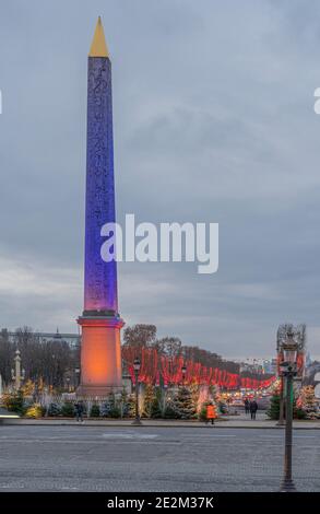 Paris,France - 12 30 2020: View of the Obelisk and the Arc De Triomphe on Place de la Concorde with Christmas lights Stock Photo
