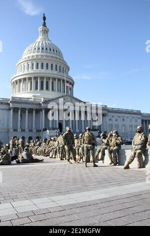 Washington, United States. 13th Jan, 2021. U.S. soldiers and airmen with the National Guard provide security at the Capitol for the 59th Presidential Inauguration January 13, 2021 in Washington, DC More than 10,000 national guard troops have been deployed to provide security following the insurrection by Pro-Trump rioters. Credit: Planetpix/Alamy Live News Stock Photo