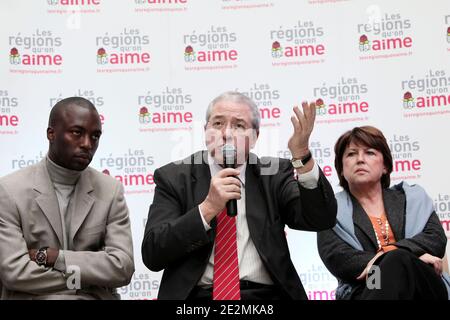 Ile-de-France region President Jean-Paul Huchon (C) speaks as French Socialist Party First Secretary Martine Aubry (R) and Val d'Oise head of list Ali Soumare (L) look on, during a press conference following a visit to an urban renovation site at the 'Croix Petit' area in Cergy-Pontoise, near Paris, France on February 2, 2010. The project, which is supported by the Ile-de-France region, consists in constructing 1,000 social housing units and a nursery. Photo by Stephane Lemouton/ABACAPRESS.COM Stock Photo