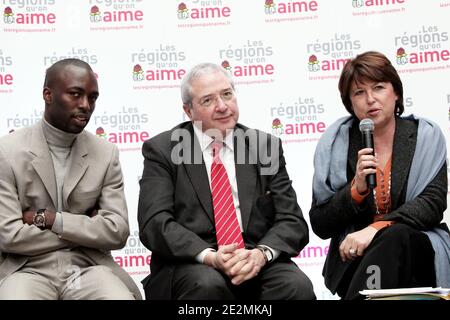 French Socialist Party First Secretary Martine Aubry (R) speaks as Ile-de-France region President Jean-Paul Huchon (C) and Val d'Oise head of list Ali Soumare (L) look on, during a press conference following a visit to an urban renovation site at the 'Croix Petit' area in Cergy-Pontoise, near Paris, France on February 2, 2010. The project, which is supported by the Ile-de-France region, consists in constructing 1,000 social housing units and a nursery. Photo by Stephane Lemouton/ABACAPRESS.COM Stock Photo