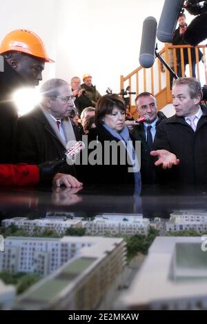 (L-R) Val d'Oise head of list Ali Soumare, Ile-de-France region President Jean-Paul Huchon, French Socialist Party First Secretary Martine Aubry and Cergy-Pontoise mayor Dominique Lefebvre during a visit to an urban renovation site at the 'Croix Petit' area in Cergy-Pontoise, near Paris, France on February 2, 2010. The project, which is supported by the Ile-de-France region, consists in constructing 1,000 social housing units and a nursery. Photo by Stephane Lemouton/ABACAPRESS.COM Stock Photo