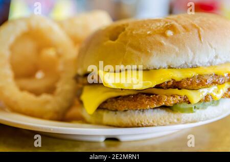 A double slugburger with cheese is served with French fries at the White Trolley Cafe, March 14, 2012, in Corinth, Mississippi. Stock Photo
