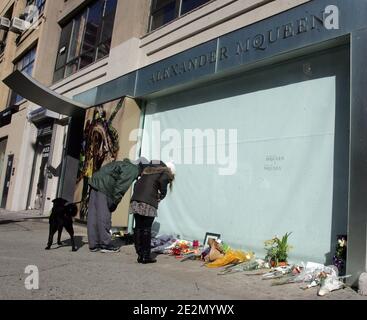People pay their respects outside the Alexander McQueen New