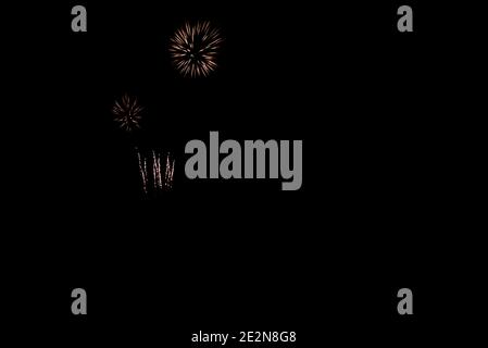 fireworks in white and orange color black sky with copy space Stock Photo
