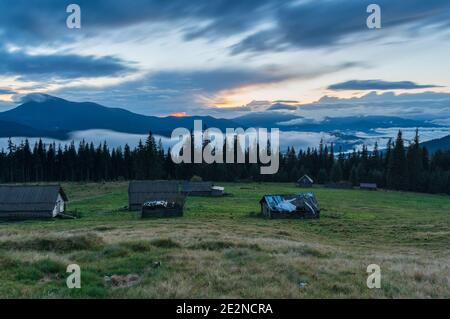 Landscape with moving clouds. Fast moving clouds over the mountains. Stock Photo