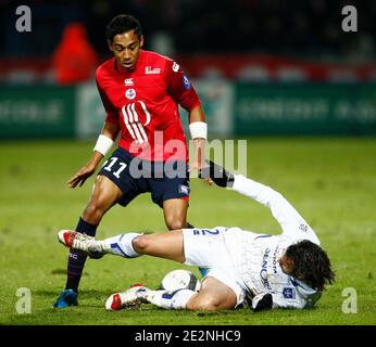 Lille's Pierre-Emerick Aubameyang fights for the ball with Auxerre's Cedric Hengbart during French First League soccer match, Lille vs AJ Auxerre at Stadium Lille Metropole in Lille, France on Febuary 28, 2010. Auxerre won 2-1. Photo by Mikael LIbert/ABACAPRESS.COM Stock Photo