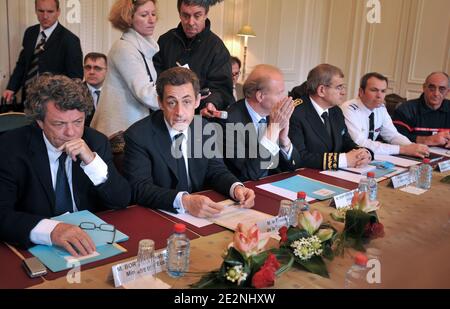 French President Nicolas Sarkozy (2dL) flanked by Ecology Minister Jean-Louis Borloo (L) and Interior Minister Brice Hortefeux (3rdL) has a meeting with local authorities in La Rochelle prefecture, western France on March 1, 2010, after flying over the flooded areas between La Rochelle and L'Aiguillon-sur-Mer. Xynthia battered this part of Atlantic coast the previous day, killing at least 50 people, driving huge waves inland in exposed towns, flooding hundreds of homes. Photo by Frank Perry/Pool/ABACAPRESS.COM Stock Photo
