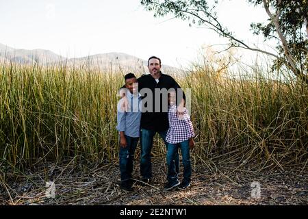 Father Posing with Sons at Park in Chula Vista Stock Photo