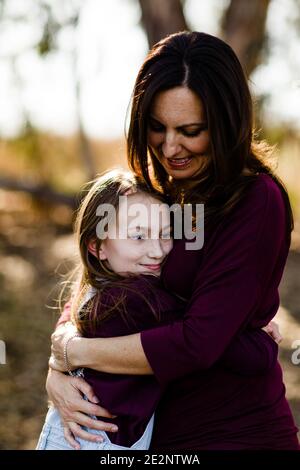 Mother Holding Daughter at Park in Chula Vista Stock Photo
