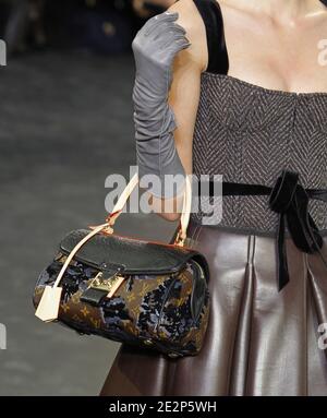 A model holds a handbag designed by Marc Jacobs for Louis Vuitton  spring-summer 2011 Ready-to-Wear collection show held at the Cour Carree du  Louvre in Paris, France on October 6, 2010. Photo