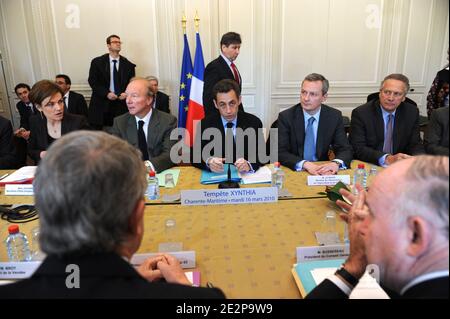 French President Nicolas Sarkozy attends meeting in presence of Junior ecology minister Chantal Jouanno, Minister for the Interior, Overseas Departments and Territorial Administration Brice Hortefeux and Minister for Agriculture, Fisheries and Food Bruno Le Maire at the Prefecture in La Rochelle, western France on March 16, 2010 about the consequences of storm dubbed 'Xynthia', which killed 52 people, unleashed gale force winds and torrential rains, destroying roads and houses along France's Atlantic coast. Photo by Mousse/ABACAPRESS.COM Stock Photo