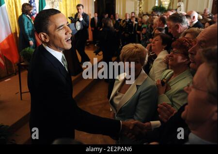 US President Barack Obama (L) greets guests following the annual St. Patrick's Day Reception in the East Room of the White House, in Washington DC, USA, on March 17, 2010. President Obama and the Prime Minister (Taoiseach) of Ireland Brian Cowen delivered remarks and participated in a traditional Shamrock ceremony. Photo by Michael Reynolds/Pool/ABACAPRESS.COM Stock Photo