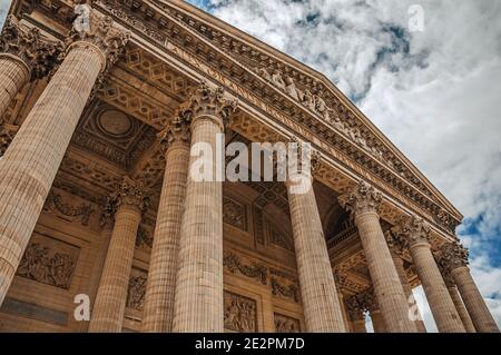 Columns at the Pantheon entrance in neoclassical style and cloudy sky in Paris. One of the most impressive world’s cultural center. France. Stock Photo