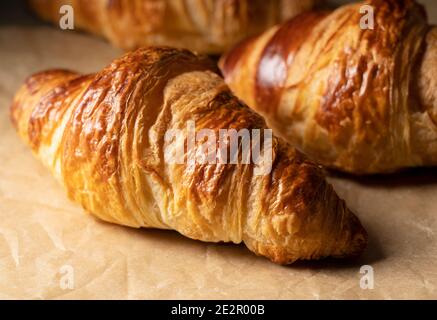 Close-up of a croissant placed on kitchen paper. Image of croissant Stock Photo