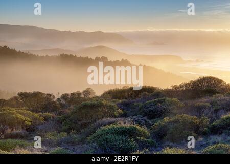 Dramatic Foggy Sunset over Pacifica via Milagra Ridge. Stock Photo