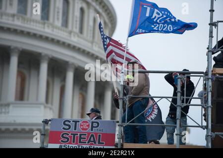 January 6th 2021. Stop The Steal sign by Protesters at Capitol Hill with Donald Trump 2020 flags. US Capitol Building, Washington DC.USA Stock Photo