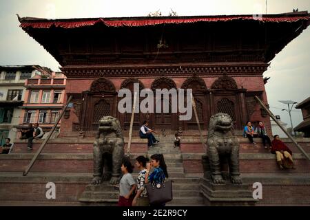People having leisure time at Shiva Parvati Mandir (Shiva Parvati Temple) in Kathmandu, Nepal. Stock Photo