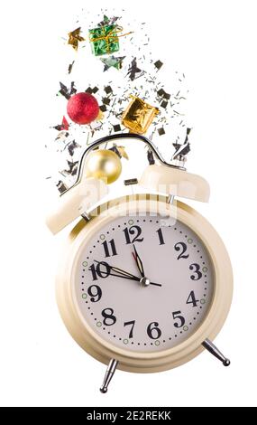 Christmas or New Year composition with retro alarm clock and Christmas decorations - stars, confetti, balls and gift boxes Stock Photo