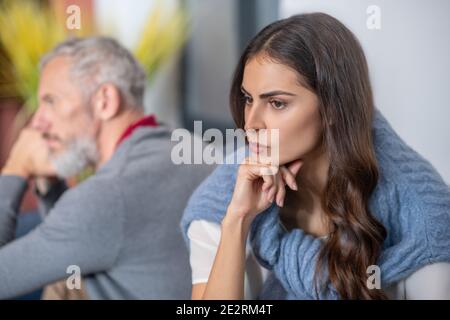 Thoughtful woman thinking over past family argument Stock Photo