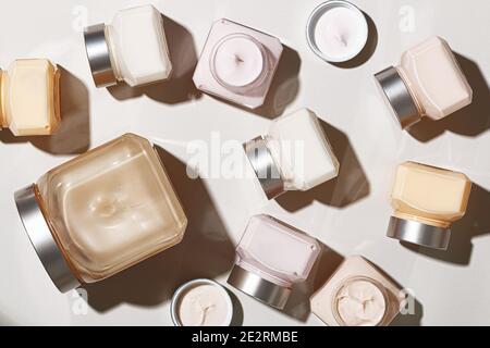 Beauty and skin care. Set of cosmetic creams in glass jars on a pastel gray background. Stock Photo