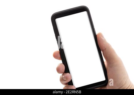 Hand holding a smartphone with blank white screen isolated on white background. Mock up. Copy space Stock Photo