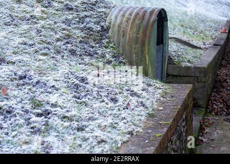 Abandoned Anderson shelter at the home of John Lewis, the founder of the general store in Hampshire. Stock Photo