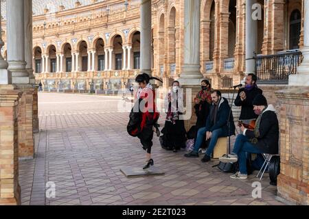 Seville, Spain - 10 January, 2021: flamenco music group and dancers performing at the Plaza de Espana in Seville during coronavirus times Stock Photo