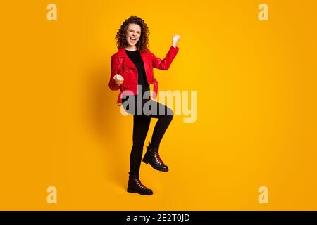Full size photo of ecstatic girl win raise fists scream isolated over bright shine color background Stock Photo