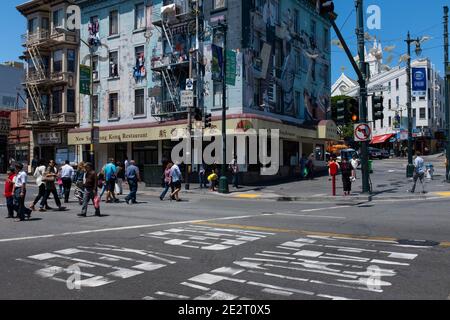 San Francisco, California - July 30, 2014: Street scene with people on a crosswalk in the Broadway, at the hearth of Chinatown, in the city of San Fra Stock Photo
