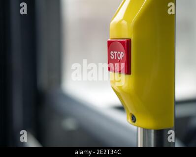 Red stop button in the public buses. Stock Photo