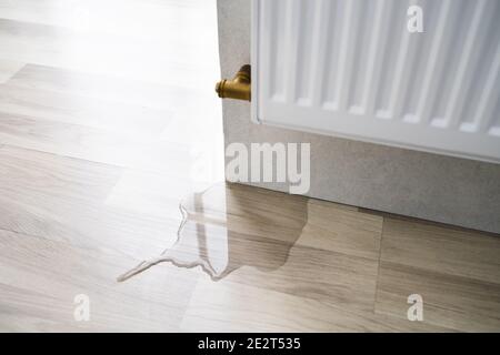 Laminate Floor Damage In Room After Heating Pipe Leakage Stock Photo