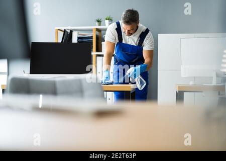 Professional Workplace Janitor Service. Office Desk Cleaning Stock Photo
