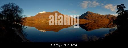 Panorama of Slioch mountain reflected in Loch Maree, Wester Ross Stock Photo
