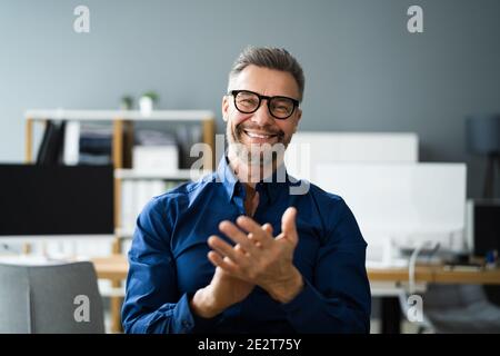 Man Clapping In Online Video Conference Business Call Stock Photo