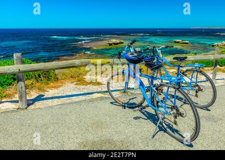 Tourist bicycles parked at Parker Point, a lookout overlooking tropical and pristine white beaches of Western Australia's Rottnest Island, a popular Stock Photo